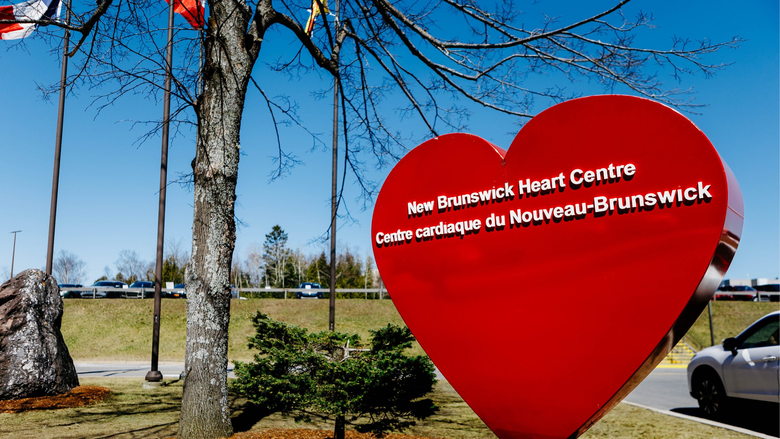 Shot of the exterior of the Saint John Regional Hospital capturing the large heart-shaped sign advertising it as the home of the New Brunswick Heart Centre.
